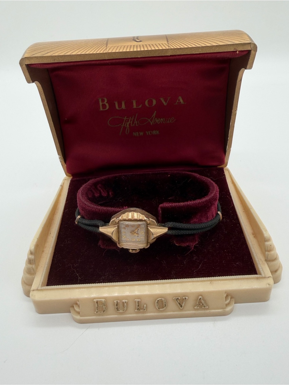 Women’s gold tone vintage Bulova watch and case